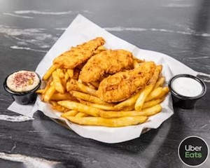 Crispy fried fish and golden French fries served with dipping sauces.