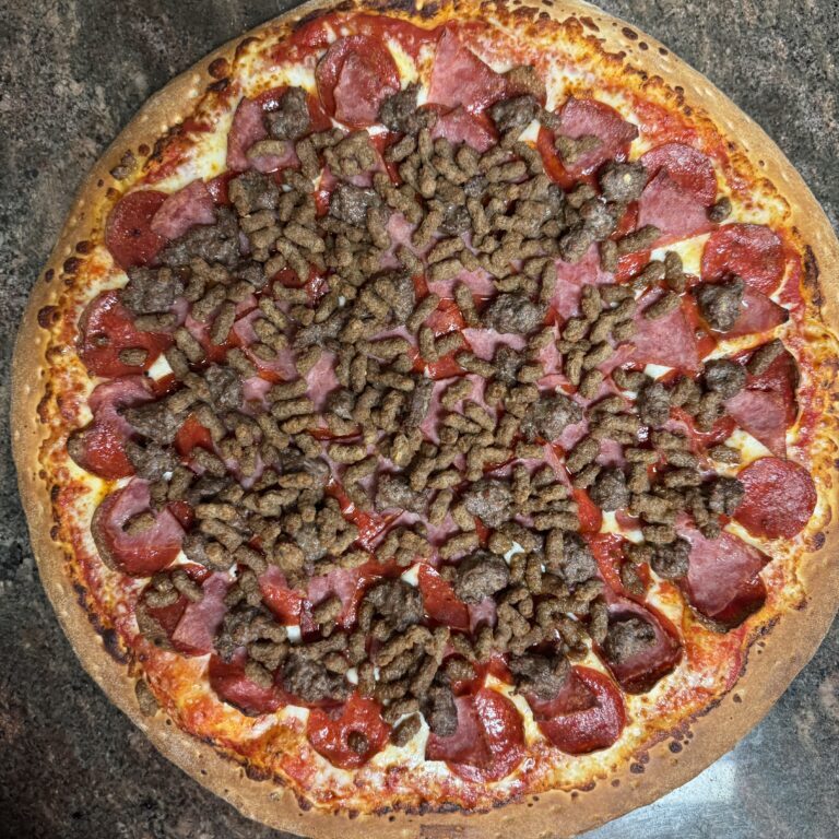 A pepperoni and sausage pizza with a golden crust.