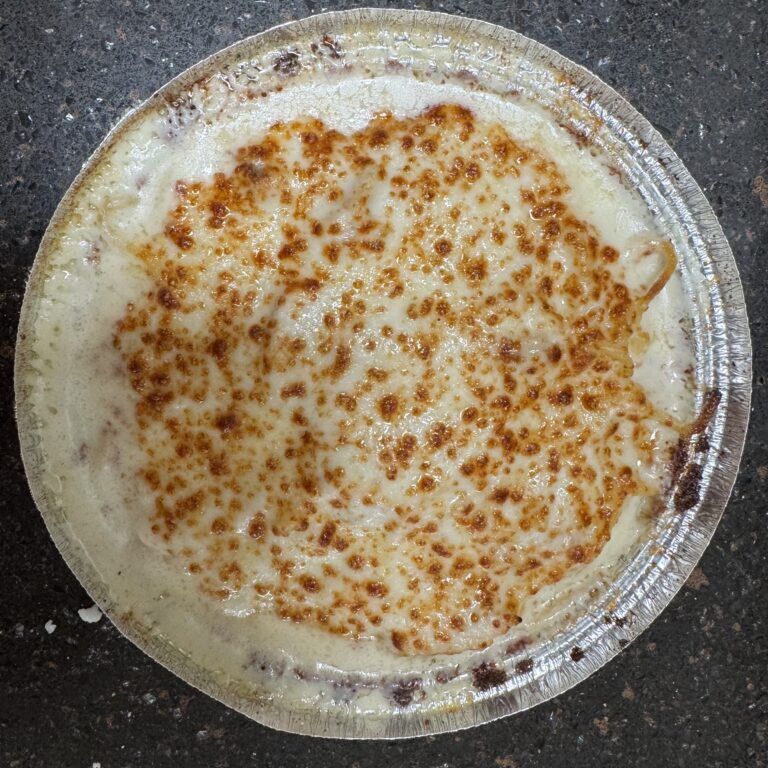 A close-up of a traditional flatbread with toasted spots on top.