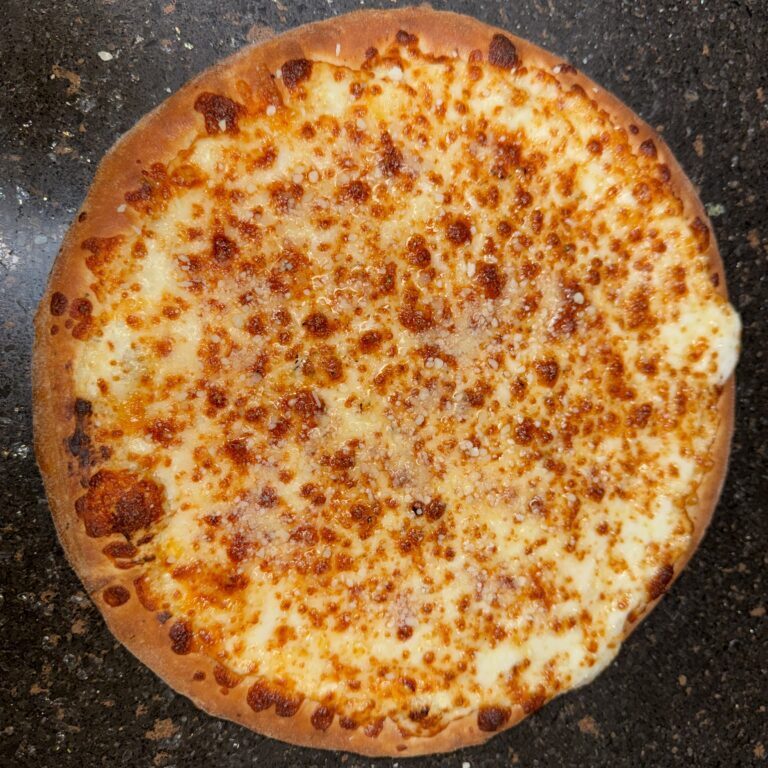 A whole cheese pizza with a golden, bubbly crust.