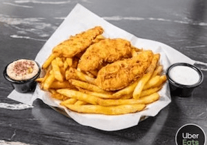 Crispy fried fish and golden French fries served with dipping sauces.