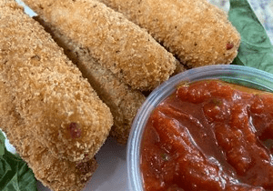 Crispy breaded mozzarella sticks with marinara sauce.